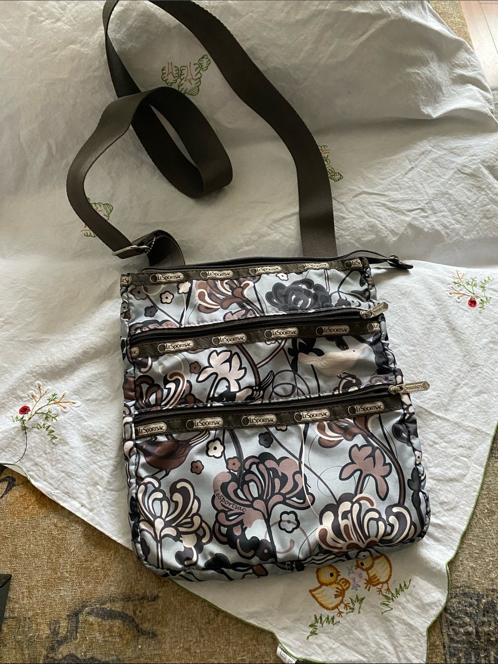 LeSportsac Floral Print Crossbody Bag in Brown, Black and Cream